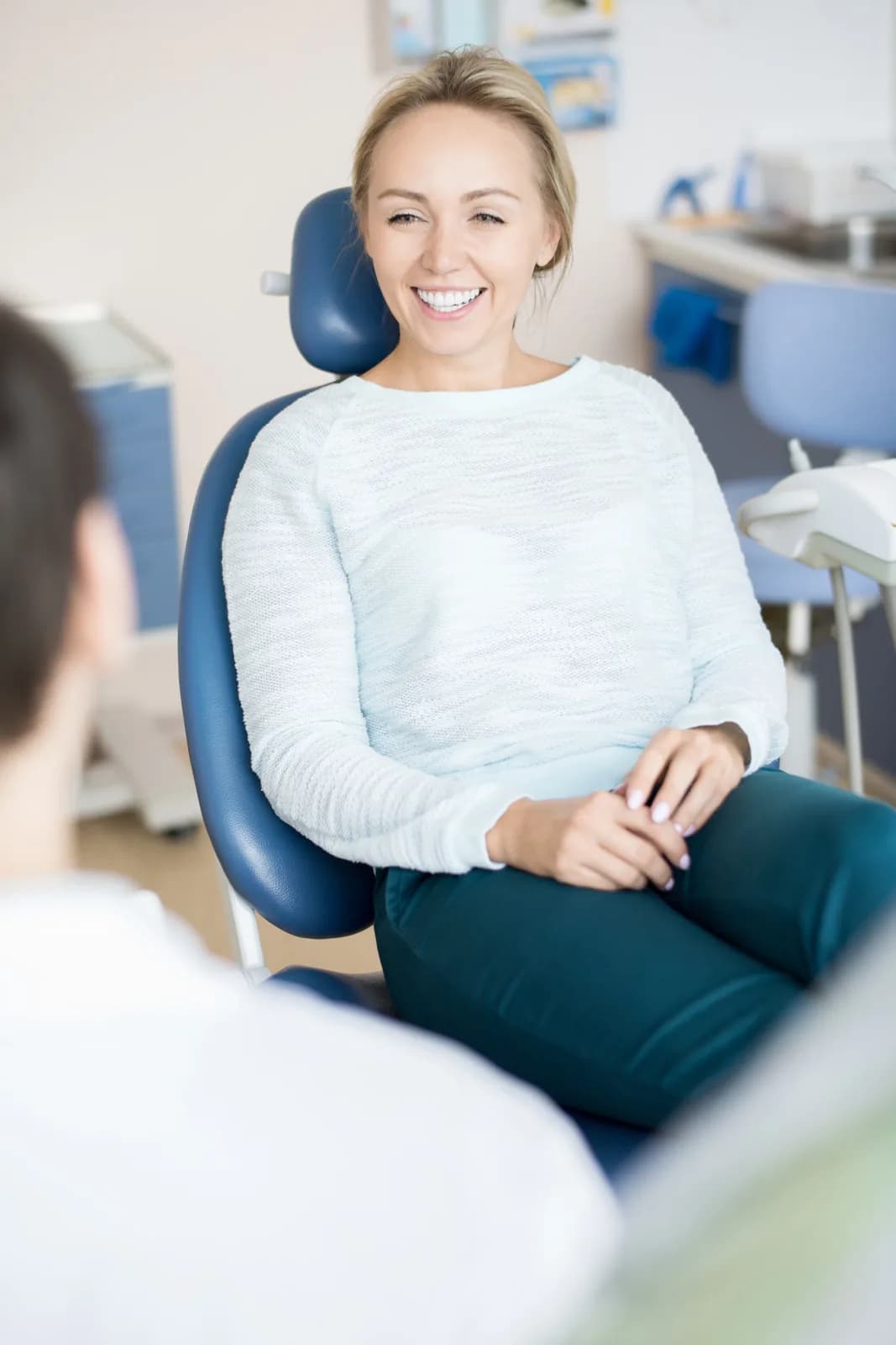 A happy patient in the dental chair at Gateway Village Dental in St. Albert